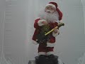 Santa dances & plays guita