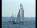 Skua sailing catamaran sailing fast past monohull Skua sailing catamaran sailing fast past monohull