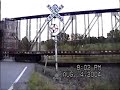 a northbound union pacific freight train passing the single wig-wag near dalton, wi.  this signal has since been replaced and the crossing upgraded to a flashing lights / gates set up.