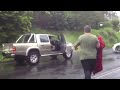 A driver almost comes to grief while negotiating a flooded Showground road in Narara on NSW Central Coast during a deluge of rain which swept the region including Sydney.