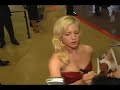 brittany snow at 11th november with a red dress, signing autographs.