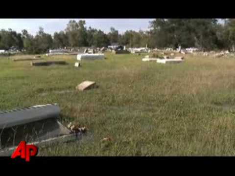 Cemetery - Dozens of volunteers in Orange, Texas are trying to restore a cemetery wiped away by Hurricane Ike. Caskets littered the cemetery following the storm, some e...