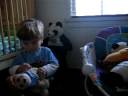 Emilio playing with his stuffed animals