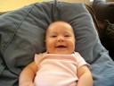 Margot Laughing on the couch
