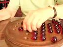 Anna Szkutek beats her own marble game record in 1 min. 20 sec.