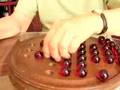 Anna Szkutek beats her own marble game record in 1 min. 20 sec.