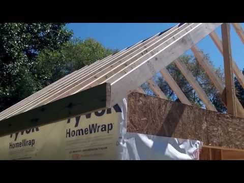  framing up the ridge beam and rafters for the roof of the shed