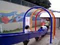 Betsy & Jane are chased down the roller slide by some local kids in Naha, Okinawa, Japan Betsy & Jane are chased down the roller slide by some local kids in Naha, Okinawa, Japan