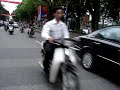 Hanoi street crossing in heavy traffic