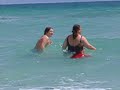 family frolicking in Pensacola Beach
