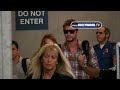 EXCLUSIVE -  And Boyfriend Liam Hemsworth Spotted At LAX