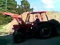 loading bales wit MF135 and drawin with fordson major