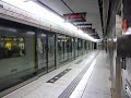 港鐵的列車開出尖沙咀站 An MTR train departs from Tsim Sha Tsui Station
