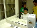 Charlsie and Elvin shave BJ's head.