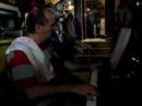 jos� pedro rosales, jazzpianist and owner of the lovely caf� 'conde de barajas' playing with a guest, antonio ximenez 'how do you keep the music playing?' 
pedro is still wearing his cooking-cloth because he prepares delicious dinners in his caf�-restaurant, but when he's got the chance, he sits down at his piano to play along with his many musical customers...

'la vida como la musica: en vivo' (jp rosales)
