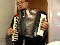 Ahmet Akarsu playing the accordion at home