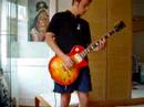 Axel playing a Les Paul to Neil Young\