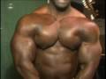 Bodybuilder Steven Frazier warms up backstage