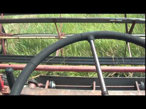 swathing - sitting on the tractor swathing.