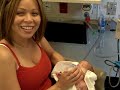 Mommy bottle feeding Caleb for the first time