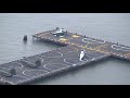 Footage of the Presidential helicopter convoy arriving in New York City at the Financial district Heliport. First 2 Chinook (or Sea Knight) helicopters arrive with security and personnel, followed by 2 Marine One's (the real one and a decoy) landing. The President then heads into the Presidential Limo (Cadillac One) and the motorcade heads up the FDR Drive. Fascinating sight! (Since I had to use high zoom there is some shaking thruout the clip, sorry)