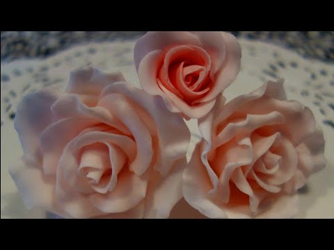 fondant suitcase cake - A short film showing how to make fondant roses for cakes, starting with the rose bud and ending with the complete flower.