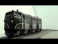 A short clip of the Marklin 37624. This locomotive is new for 2010, and has a MFX decoder with many different sound effects. Prototype: Pennsylvania Railroad General Motors EMD type F 7. Three-unit locomotive consisting of an A unit, B unit, and an A unit. Model: The locomotive comes with an mfx digital decoder mfx and extensive sound functions. There is 1 motor in each A unit and a speaker in the B unit. Each A unit has 2 axles powered. Traction tires. The headlights and lighted number boards will work in conventional operation and can be controlled digitally. The sound effects generator has diesel locomotive operating sounds. There is a permanent drawbar between the locomotive units. A snowplow is included for installation on the locomotive. Length 52 cm / 20-1/2