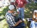 People Playing Cigar Box Fiddles