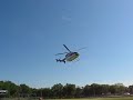 ATU Helicopter taking off backward from football field.