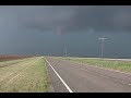 south plains, texas tornado may 12,2005.tornado remains in open field and just misses a farm house. as tornado dissapates destructive large hail began to fall.