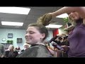 Angela and Chris shave their heads to raise money for cancer research in memory of their grandmother who died of cancer.