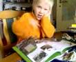 Tuukka reads dinosaurus book