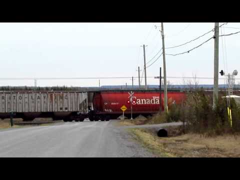 8903 - It's a cold, windy day out in Central Ontario. CP 114 is in a rush. Like an angry moose coming out of the forest, the train is climbing away from the Lake On...