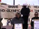 Tibetans shave heads in Harvard Square, Cambridge, Mass.