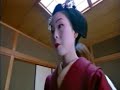 Maiko or geisha being dressed in kimono and other garments