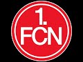 Ein Fels in wilder Brandung, der alles überstand. Er hielt in vielen Jahren, so manchen Stürmen stand. Ein Fels in wilder Brandung, ist unser FCN. Sein Stern, er wird für immer, am Fussballhimmel stehn! Die Legende lebt, wenn auch die Zeit vergeht. Unser Club, der bleibt bestehn! Die Legende lebt, wenn auch der Wind sich dreht. Unser Club, wird niemals untergehn! Die Uhren laufen schneller, die Zeit sie bleibt nicht steh'n. Der Weg führt in die Zukunft, so vieles wird geschehen. Ein Fels in ...