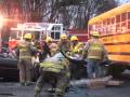 Car runs off road; wedged under school bus in Poconos