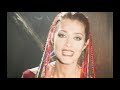 Music video by Natassa Theodoridou performing Dihos Logo Ke Aformi. (C) 1997 Sony Music Entertainment (Greece) AE