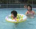 Cyanne swimming with float