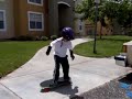 4 year old skateboarder jumps 1/2 inch off ground