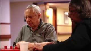 an older man playing a card game