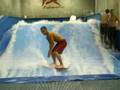 surfing in indoor wave pool