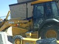 Pushing salt wthe da 310G backhoe