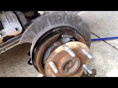 how to adjust parking brake on 2004 yukon