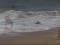 attempting to skimboard