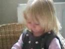 amelie playing quietly in her chair