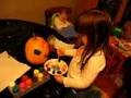 Emily painting her Halloween pumpkin