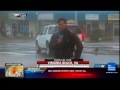 Enjoying Hurricane Irene behind weather channel reporter
