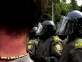 please read!!!  this video shows how the police continued to build up the intimidation level throughout the day. the crowd was doing fine, then the first group of riot police came marching out and formed a line. they had no masks and a white patch on their shoulder. the crowd took notice and approached the line. things were fine for a few hours, but then another group of police switched places with the first ones. this second group had a red patch instead of a white one (a little more intimidating). as a result of that, the crowd got a little more worked up. after a few more hours, those cops were switched for ones wearing gas masks. again as a result the crowd was getting a little bit more worked up. then the next 