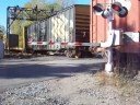 brand new csx es44ac 946 along with c40-8w 7316 (still in conrail blue), sd40-2 8856 and ltex sw1200 3501 (larry's truck and electric, ex bnsf) lead a westbound freight train across south creek road and over ganargua creek near palmyra, ny on 10-11-08. south creek road crossing is located at mp q346.25 on the csx chicago main line.